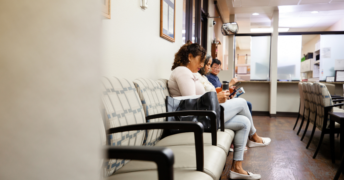 patients siting and waiting in waiting room, experiencing hidden wait times
