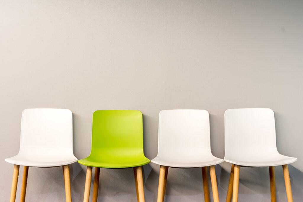 four chair lined up against a wall